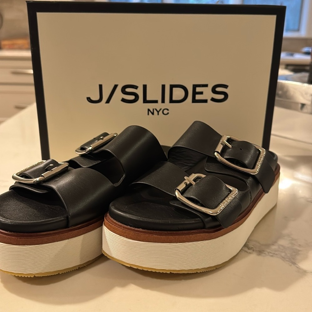 J slides platform. Black leather.